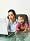 Flexible Working Parent, using a phone & laptop while holding a child